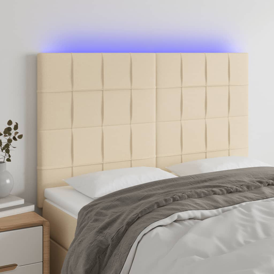 vidaXL Sänggavel LED gräddvit 144x5x118/128 cm tyg